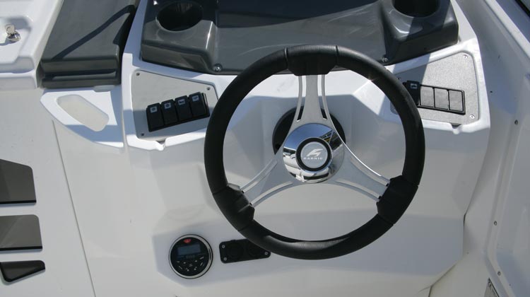 Marine grade electrical switches, compass, media/receiver, USB and 12V sockets and Karnic sport steering wheel
